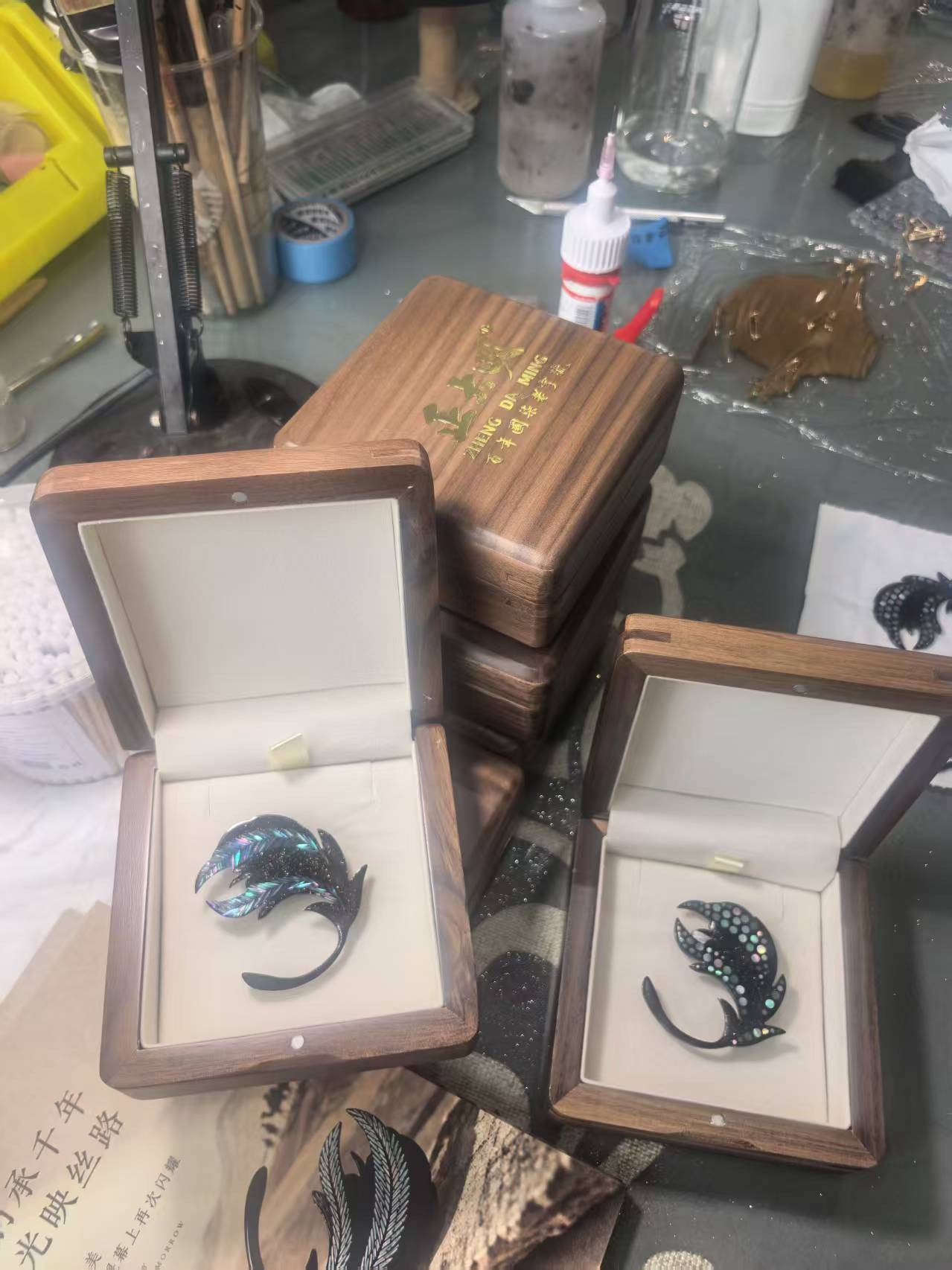 Light on the Silk Road brooches being packed in the workshop